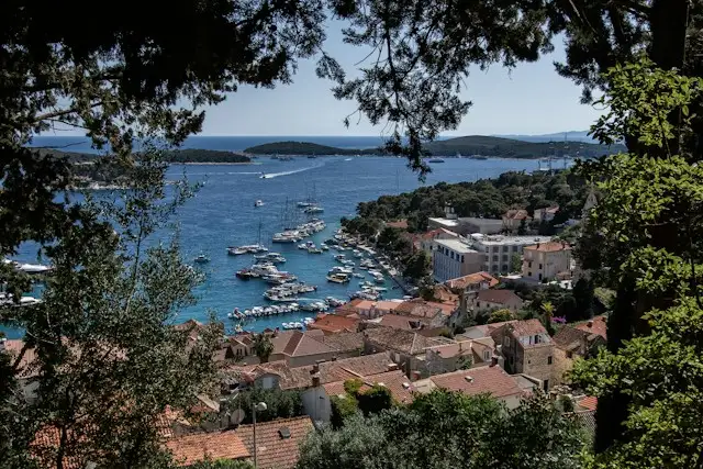 Hvar Town harbour with holiday homes and the Pakleni Islands