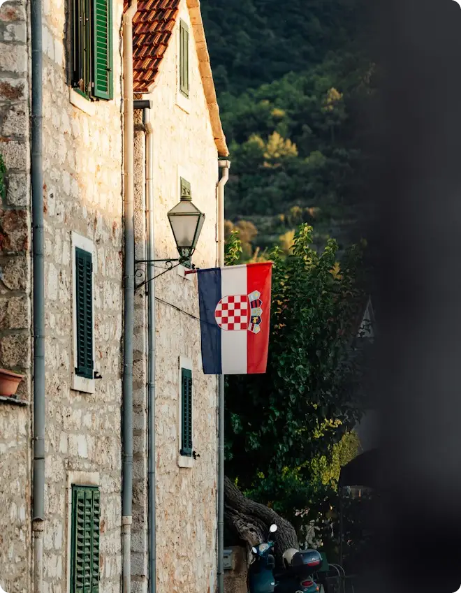 Croatian flag on a stone house in Stari Grad, Hvar